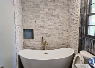 bathroom remodeling with soaking tub and accent wall
