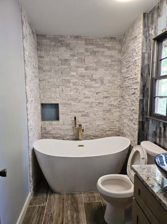 bathroom remodeling with soaking tub and accent wall